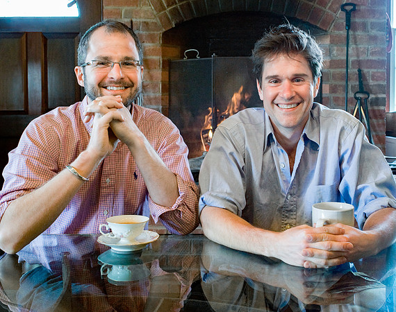 Portrait of The Fabulous Beekman Boys at their kitchen table with cups of coffee.