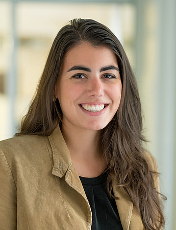 Portrait of smiling young woman wit long dark hair