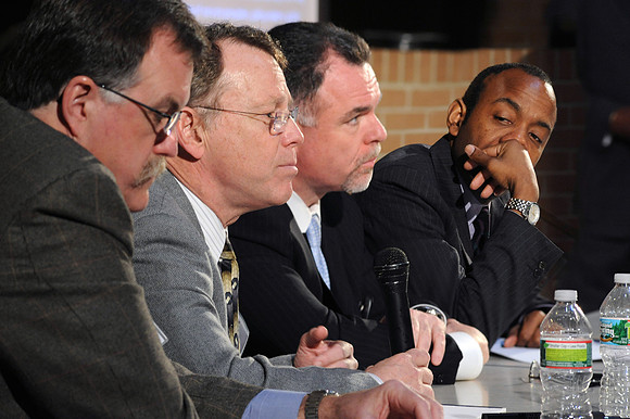 Four speakers at table at the Conference on Reducing Crime and Incarceration