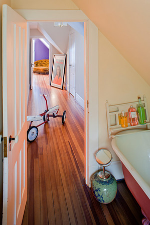 long hallway with vintage childs tricycle